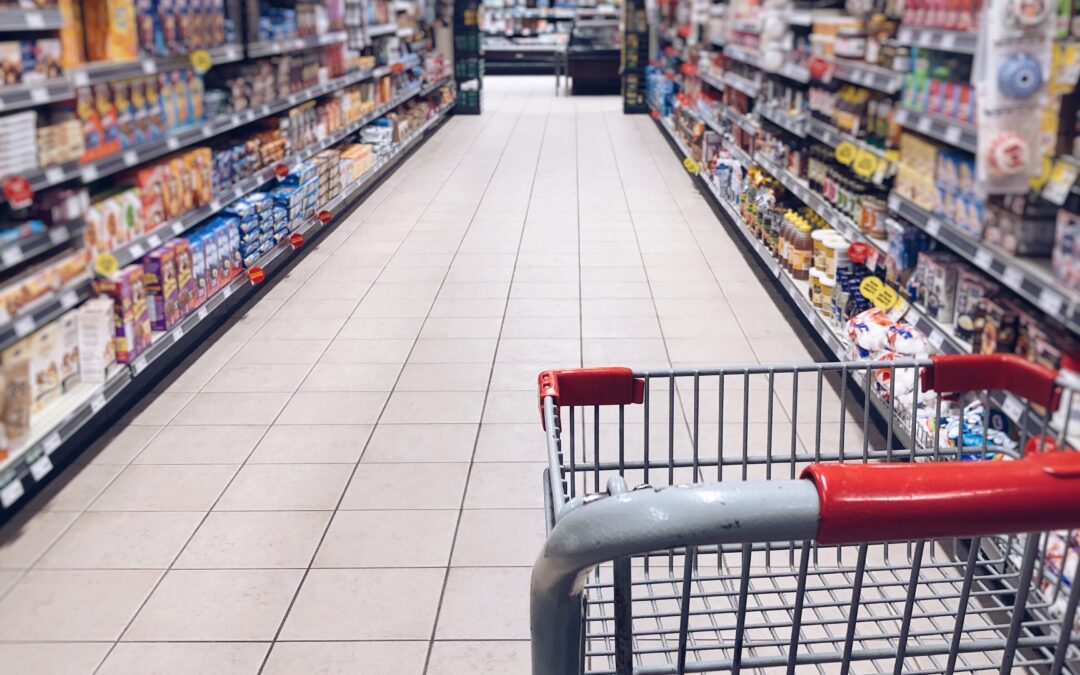 grocery cart looking down a grocery store aisle